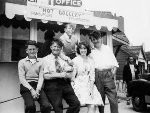 Martin and his family outside their hot dog stall 'Hot Doggery', Jaywick, Clacton, UK, 1960s