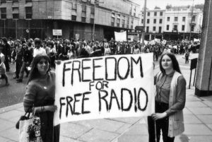 Protesters holding up a banner reading 'Freedom for Free Radio' at the Anti-Jamming Rally, London, UK, June 14th 1970