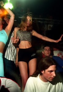 Club goer wearing a leopard print top and shorts and dancing, Oscars, Clacton Pier, Essex, UK, 17th May 1997