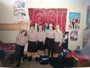 George Holt- GH0001 George with her roommates in their shared room at boarding school, Wiltshire, South West England, UK, 2000.